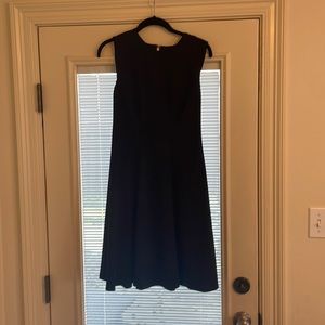 Tommy H navy blue dress with silver hardware, size 4.